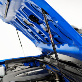 Redline Tuning gas spring close-up showing black e-coat for long-lasting protection