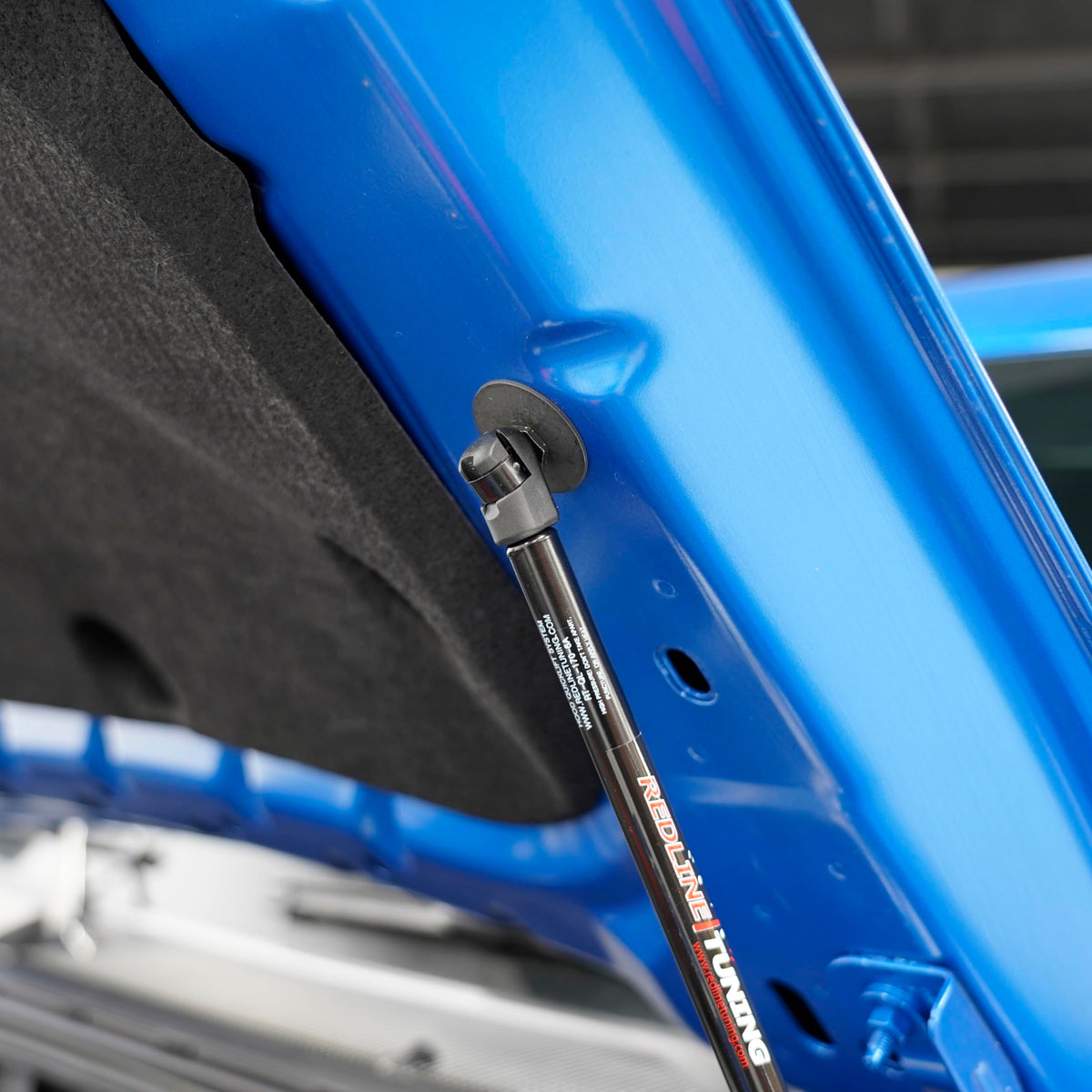 Redline Tuning mounting bracket detail illustrating bolt-in ease and stability