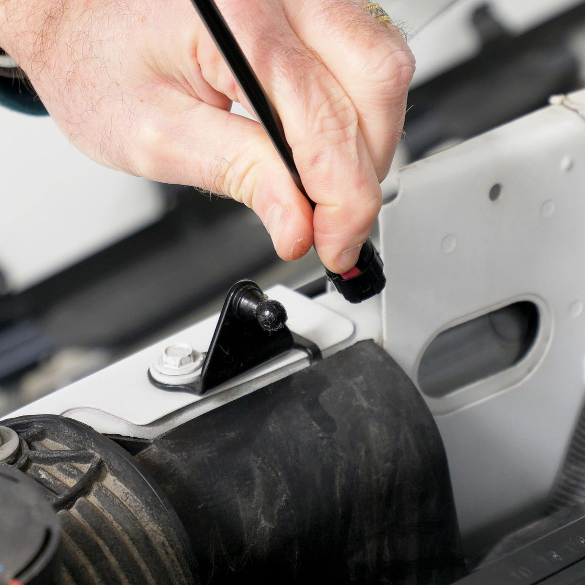 Redline Tuning quick-release mechanism detail enabling tool-free detachment