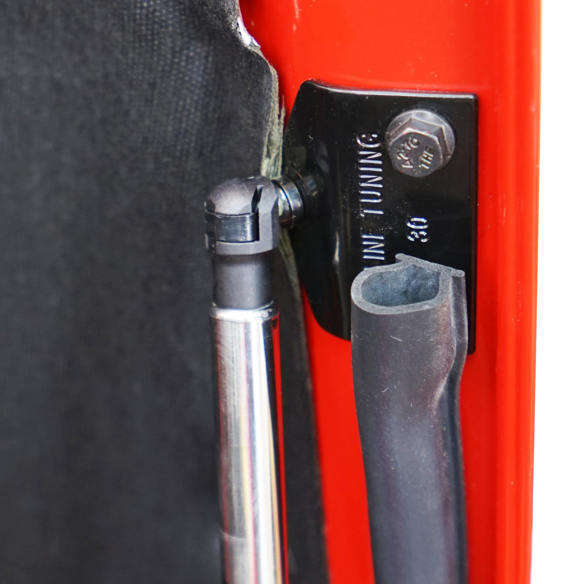 Redline Tuning side profile with hood open showing controlled lift and clearance