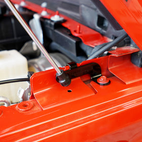 Redline Tuning mounting bracket detail showing bolt-in hardware and fitment