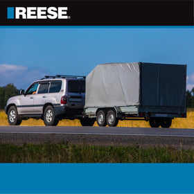REESE lock set in use on trailer coupler demonstrating theft prevention while parked