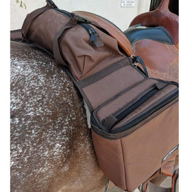 Reinsman cantle bag and straps close-up showing snap closures and straps for carrying bedrolls securely