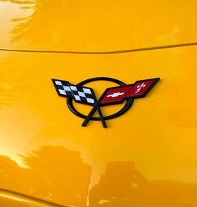 REIXS front view of Cross Flags emblem showing bold black red finish and visual upgrade