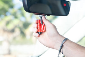 RESQME clipped to sun visor showing easy reach and quick retrieval in emergencies