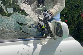 RESQME demonstrating spring-loaded steel spike striking a car window for rapid exit