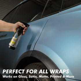 Rev Auto being wiped on a vinyl-wrapped car to remove scuff marks, effective cleaning