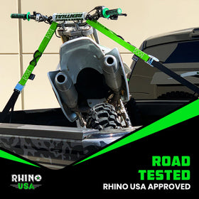 Rhino USA lifestyle shot loading bike into trailer for convenient transport