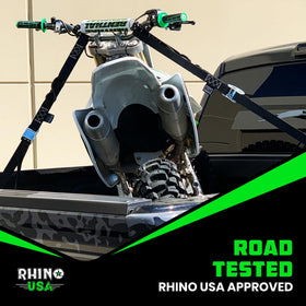 Rhino USA loading a bike into a trailer illustrating practical use and travel-ready security