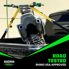 Rhino USA lifestyle truck bed setup showing straps securing bike safely for travel