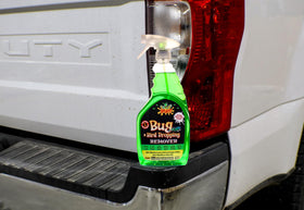 Rislone being sprayed on a car bumper removing bug and bird splatter for restored finish