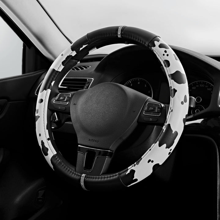 Road Comforts front view of cow pattern steering wheel cover showing stylish design and protection