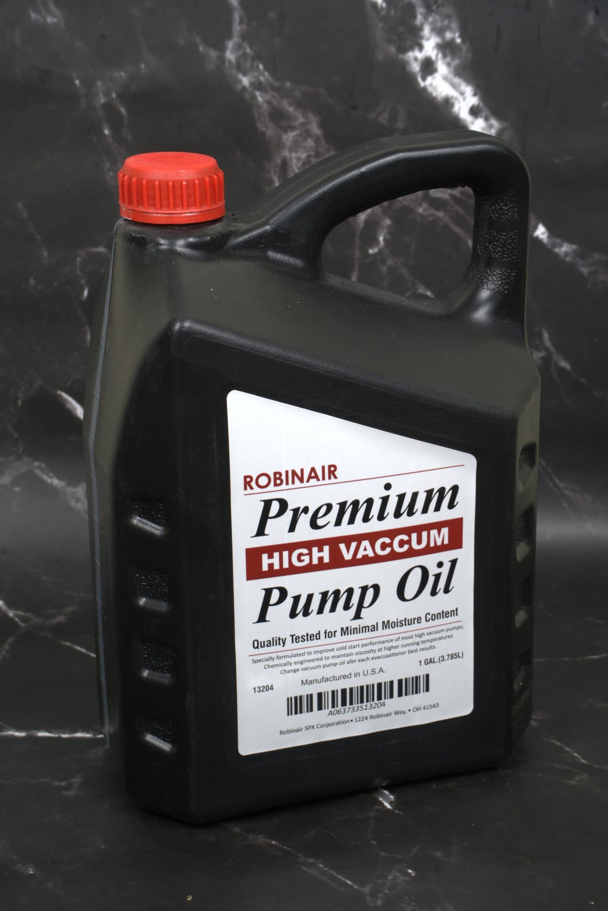 Robinair bottle being poured into a vacuum pump illustrating maintenance efficiency benefit