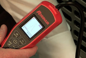 Robinair LD7 being used in an engine bay to quickly locate a refrigerant leak