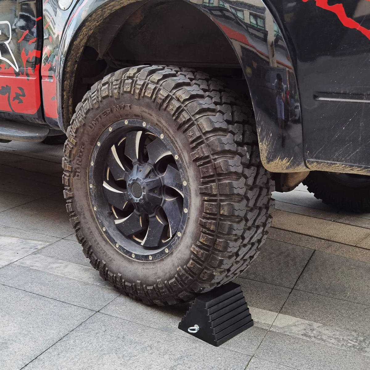 ROBLOCK chock positioned under RV tire demonstrating secure immobilization