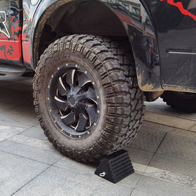 ROBLOCK chock positioned under RV tire demonstrating secure immobilization