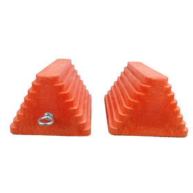 ROBLOK chocks at a campsite beside an RV for visible safety and convenience