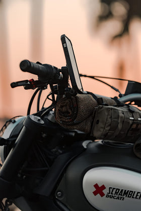 Rokform lifestyle shot on cruiser road showing durable mount in real riding conditions