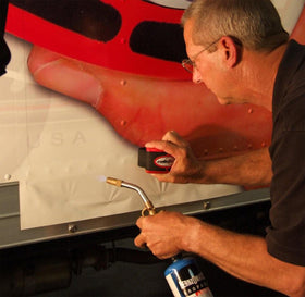 Rollepro in hand demonstrating comfortable grip for reduced installer fatigue