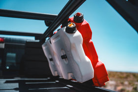 RotopaX beside a hiker to show 2 gallon scale and easy portability
