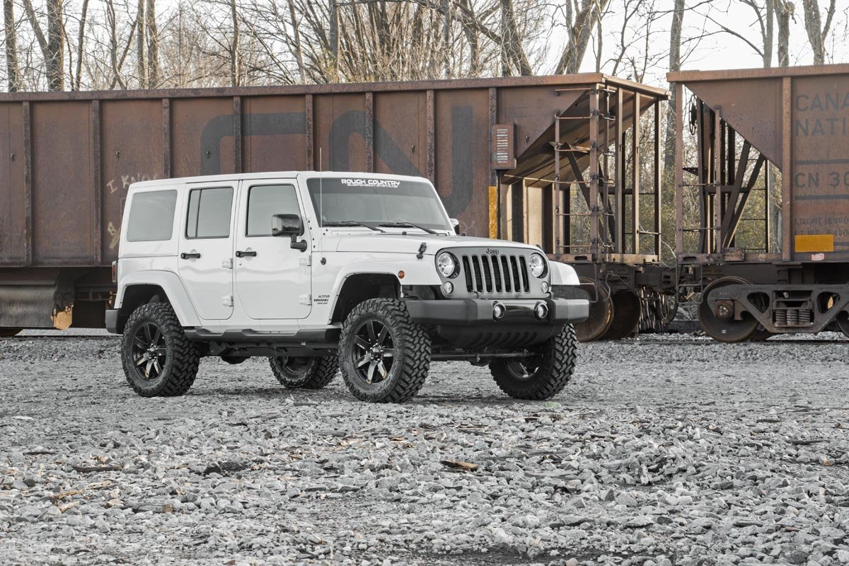 Rough Country Jeep driving off-road demonstrating improved trail performance