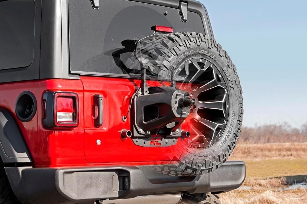 Rough Country bracket next to 35" spare showing scale and fitment confidence
