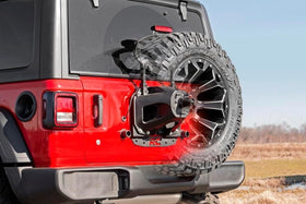 Rough Country bracket next to 35" spare showing scale and fitment confidence