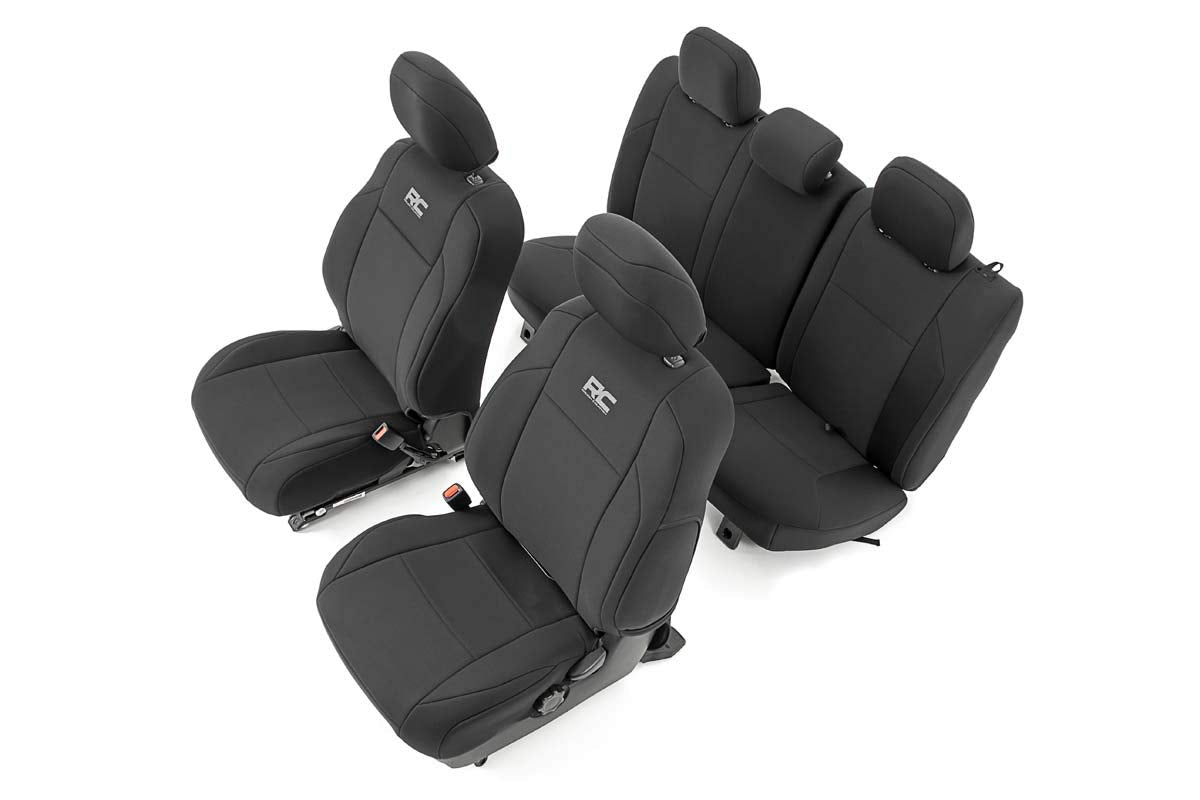 Rough Country front seat covers on Tacoma showing snug, protective fit