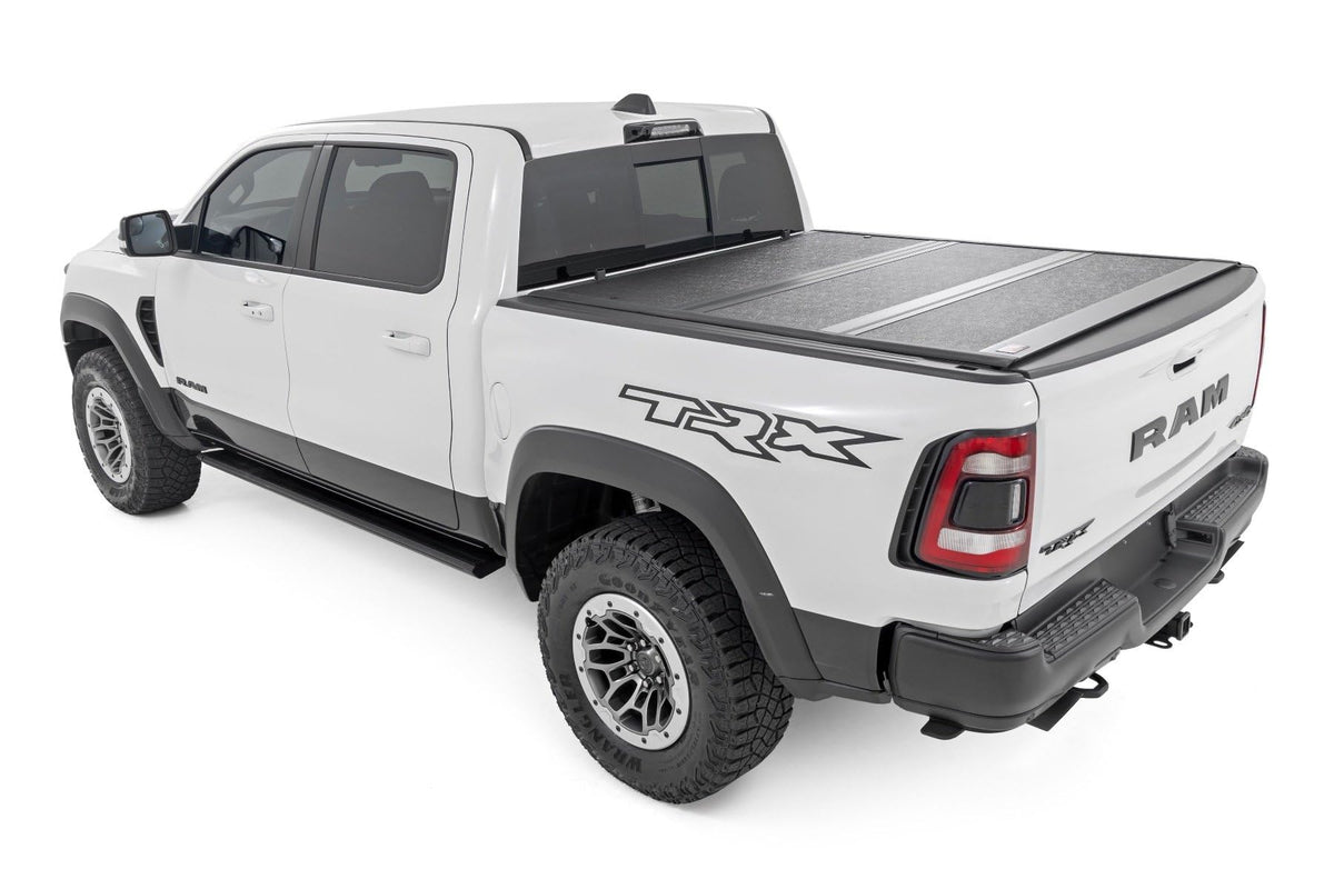 Rough Country folded cover in use allowing quick bed access and secure cargo reach