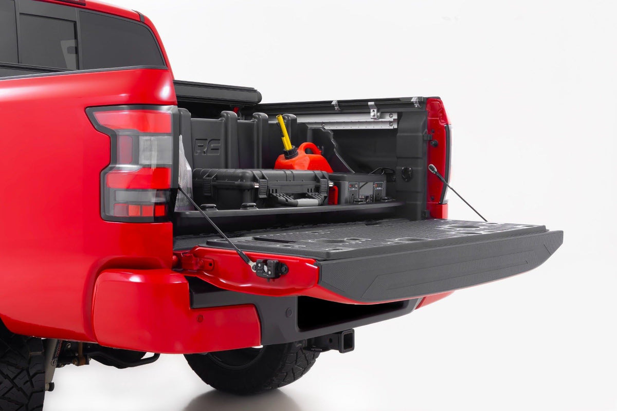 Rough Country storage box installed under tonneau cover protecting gear from weather