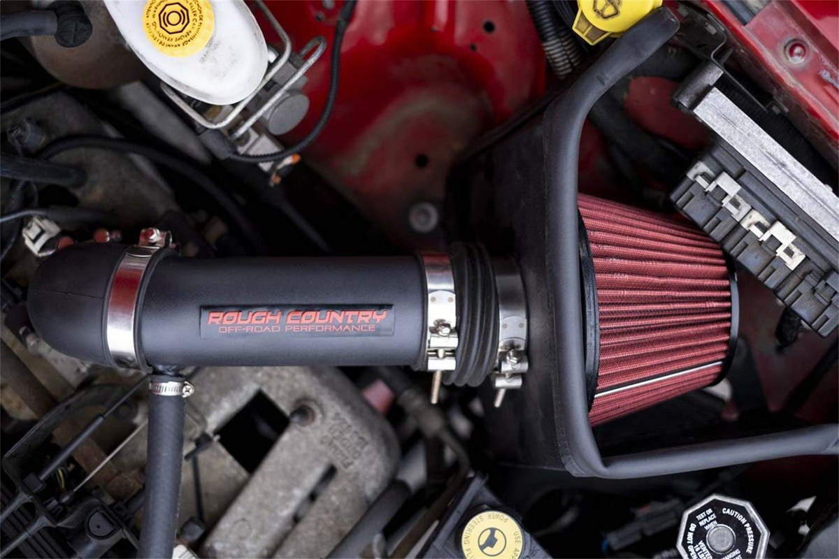 Rough Country intake on towing Silverado in landscape illustrating improved towing power and reliability