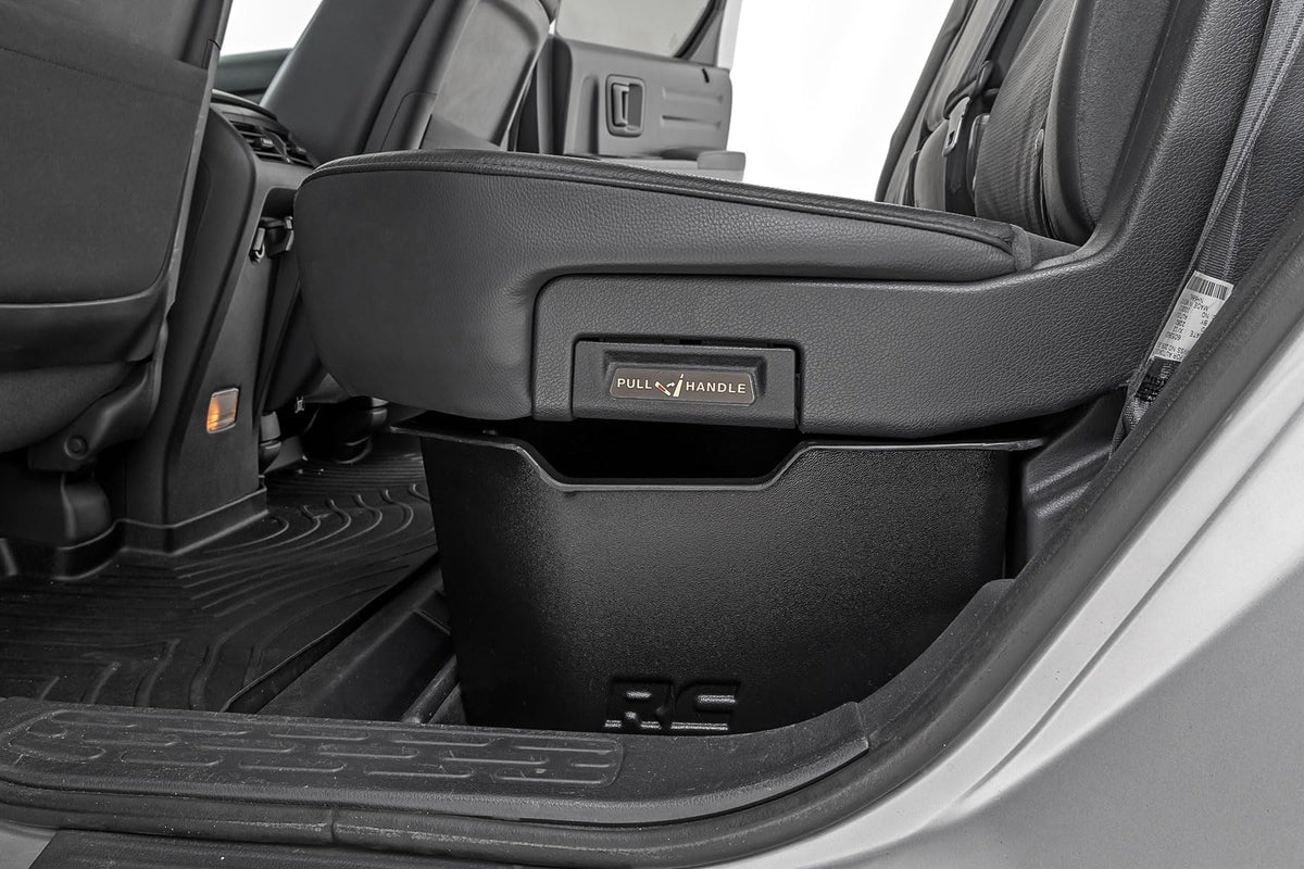 Rough Country lifestyle shot of truck cabin with organized underseat storage reducing clutter