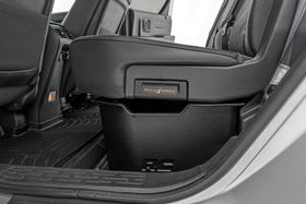 Rough Country lifestyle shot of truck cabin with organized underseat storage reducing clutter