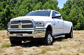 Rough Country truck in park offroad setting showing improved ground clearance and capability