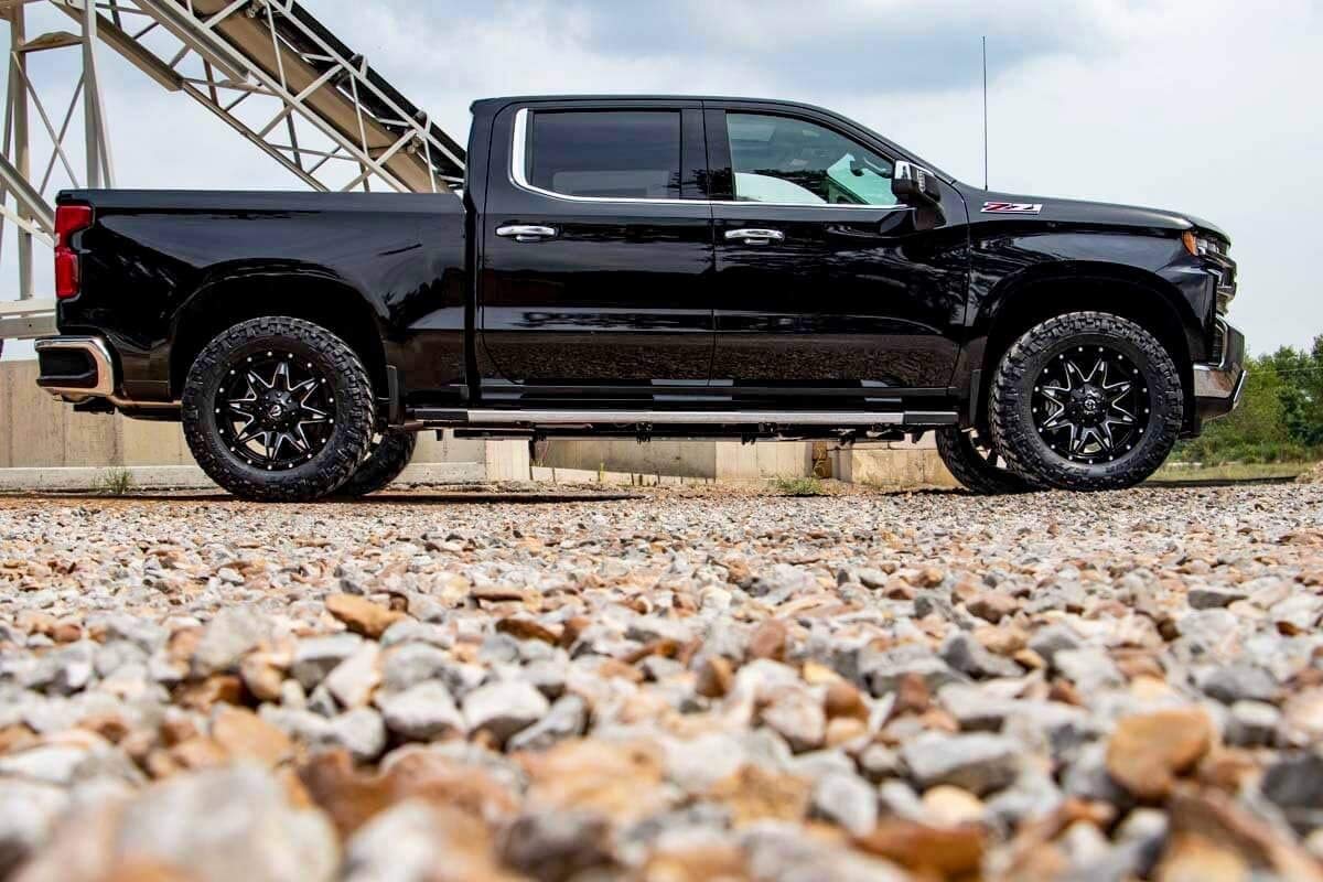 Rough Country-equipped truck on dirt road showing improved approach clearance