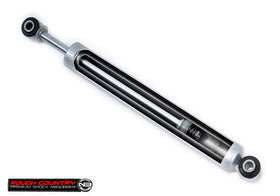 Rough Country shock beside ruler showing size and lift compatibility