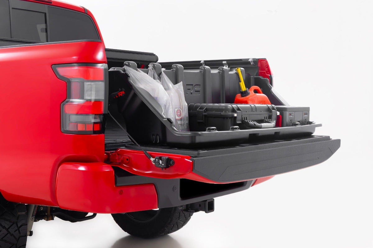 Rough Country box pulled onto tailgate demonstrating effortless slide-out access