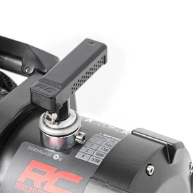 Rough Country wired remote in hand demonstrating safe distance control during winching