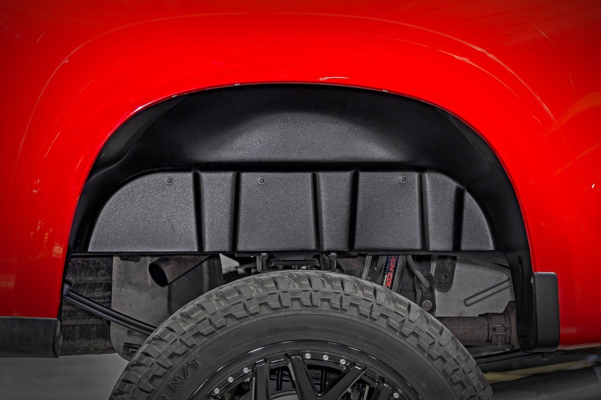 Rough Country rear wheel well liner front view showing fit and protection
