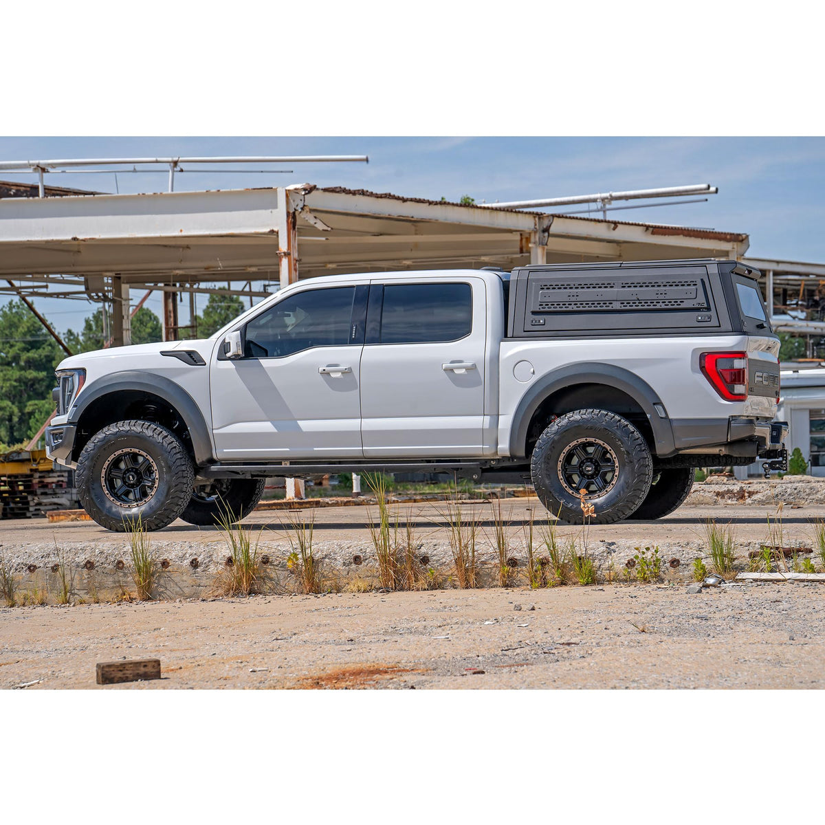 Rough Country lifestyle shot of Raptor off-road showing cleaner rear wheel wells