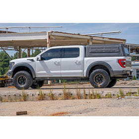 Rough Country lifestyle shot of Raptor off-road showing cleaner rear wheel wells