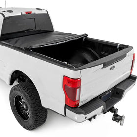 Rough Country roll-up action demonstrating quick cable release for rapid full-bed access