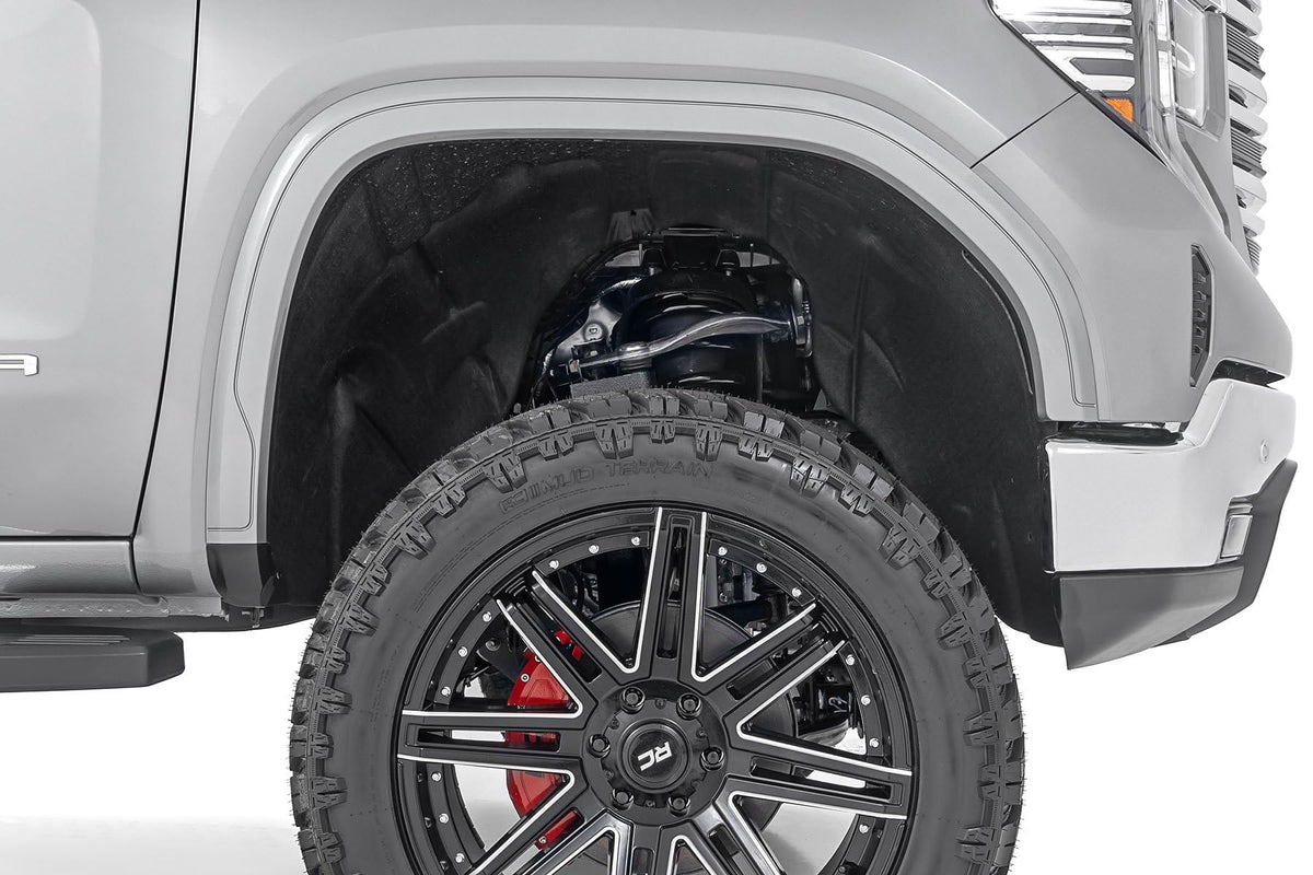 Rough Country delete next to tire showing added clearance and scale