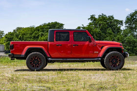 Rough Country scale comparison of stock versus leveled Gladiator showing added tire clearance