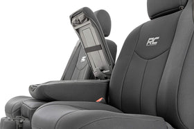 Rough Country cover fitted around armrest preserving seat function