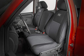 Rough Country seat covers in truck interior with family gear showcasing durable protection