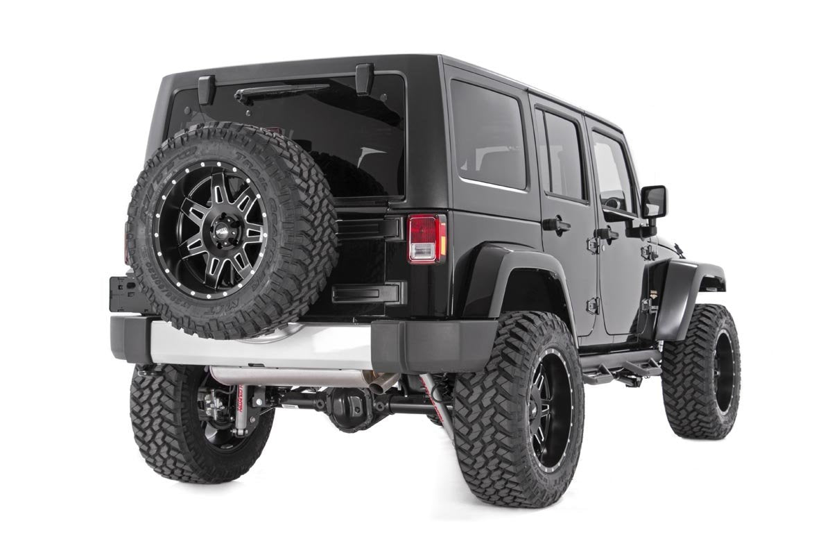 Rough Country spacer installed on Jeep Wrangler showing larger spare fit benefit