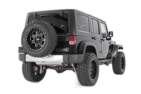 Rough Country spacer installed on Jeep Wrangler showing larger spare fit benefit