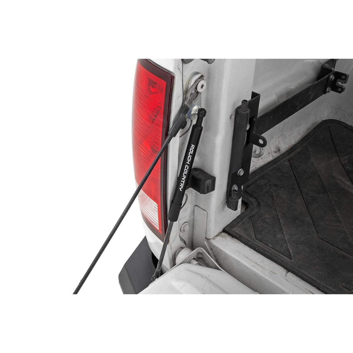 Rough Country tailgate assist showing front mount and smooth lowering benefit
