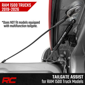 Rough Country tailgate assist beside ruler showing scale for fit and compatibility